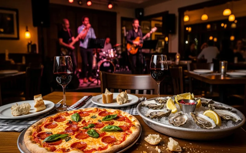 Pizza and oysters on table, live music bar, casual local restaurant, warm lighting