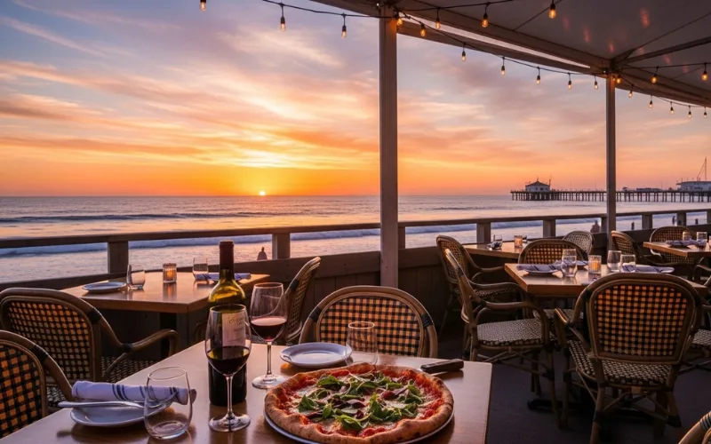 “Beachside restaurant in Venice LA, sunset, pizza and wine on table, ocean view dining”