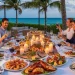 Aruba island, luxury dining table with candles, seafood dishes, Outdoor patio dining, relaxed dining scene.couples sitting